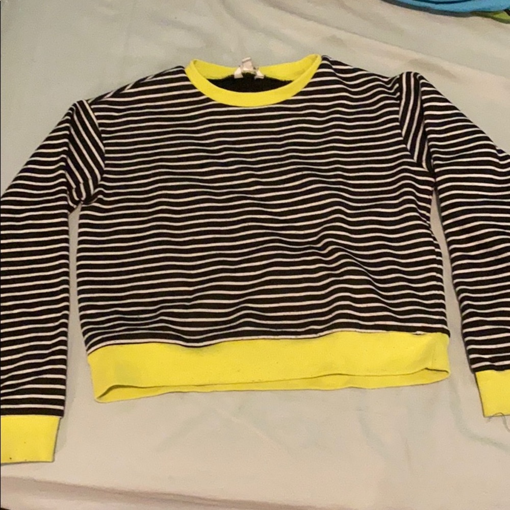 A black white and yellow sweat shirt